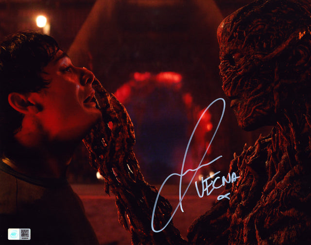 A signed Jamie Campbell Bower Signed - Photos - 11x14 — A - 11x14 Photo with Character Name