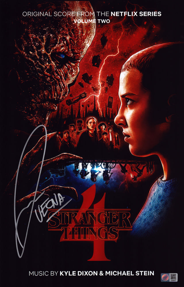 A signed Jamie Campbell Bower Signed - Photos - 11x17 — A - 11x17 Photo with Character Name
