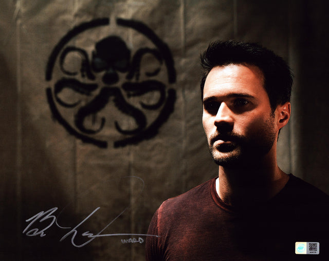 A signed Brett Dalton Signed - Photos - 11x14 — A - 11x14 Photo with Character Name