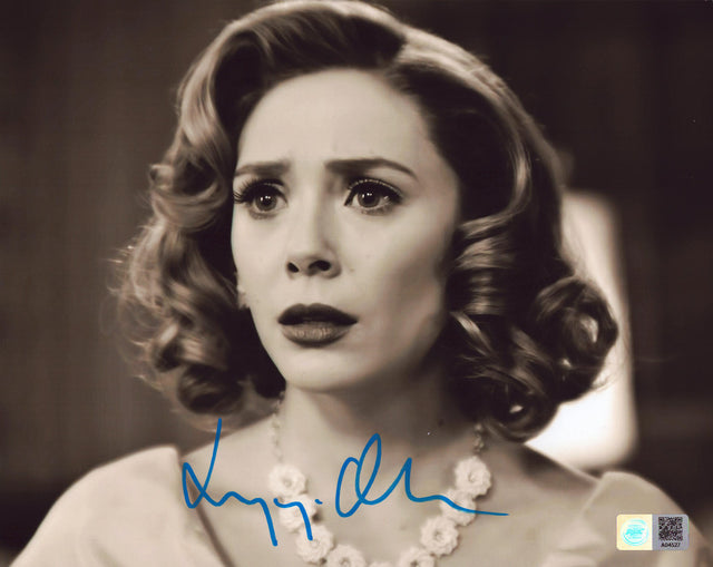 A signed Elizabeth Olsen Signed - Photos - 8x10 — C - 8x10 Photo