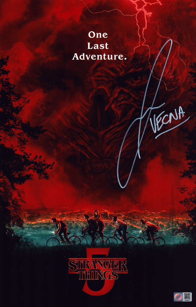 A signed Jamie Campbell Bower Signed - Photos - 11x17 — B - 11x17 Photo with Character Name