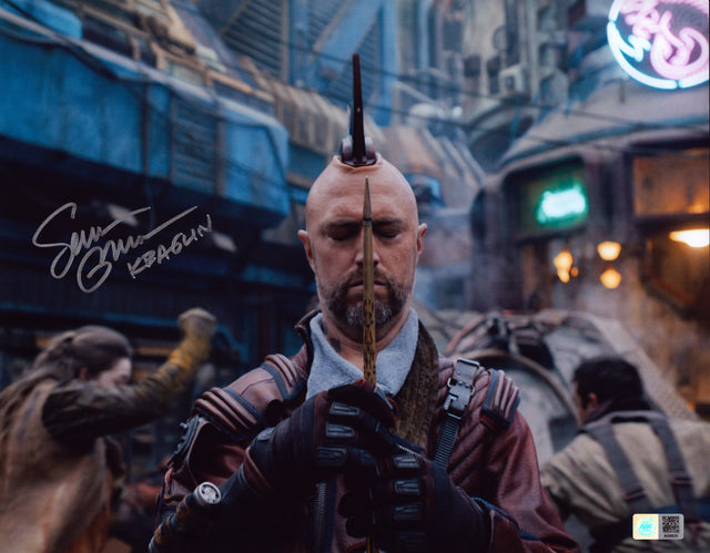 A signed Sean Gunn Signed - Photos - 11x14 — A - 11x14 Photo with Character Name